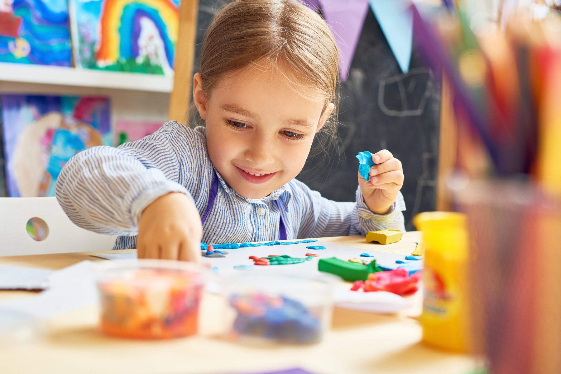 young girl using wholesale school supplies in DIY projects