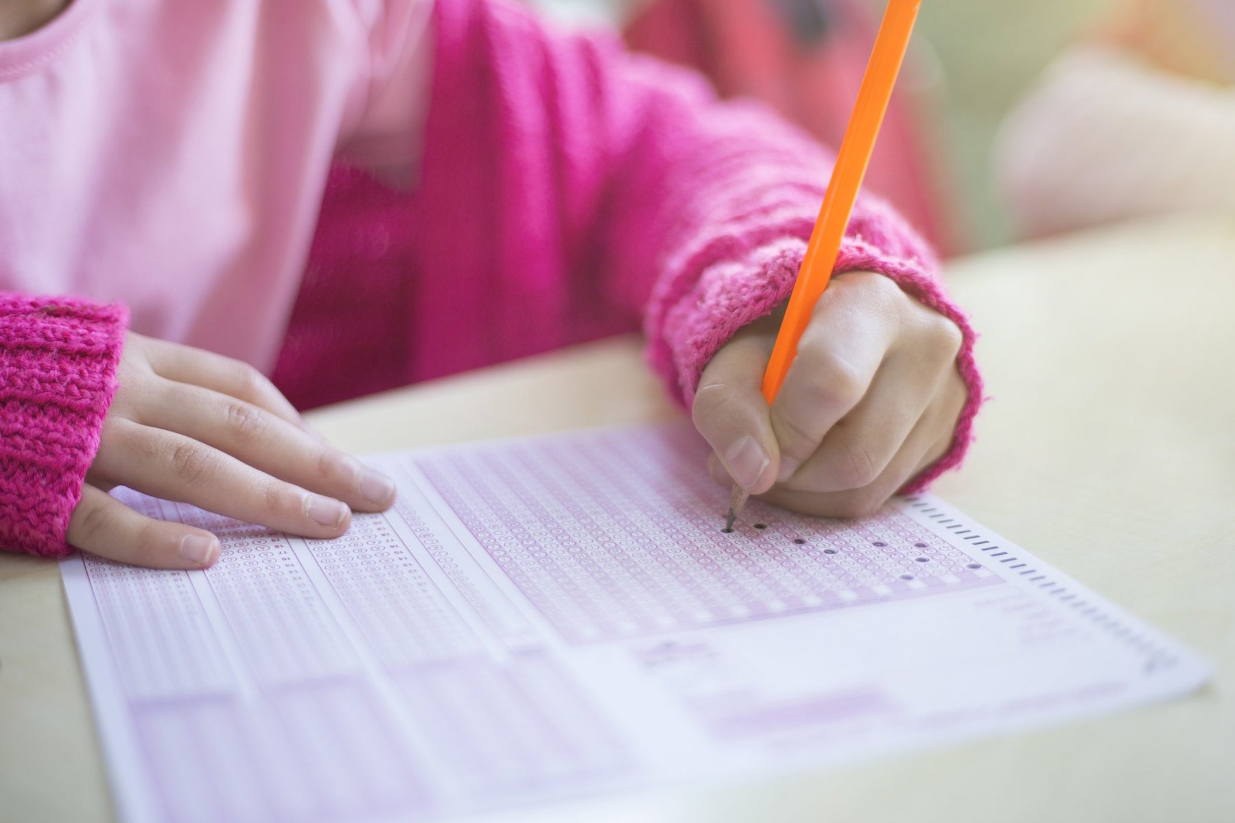 student taking test with wholesale school supplies
